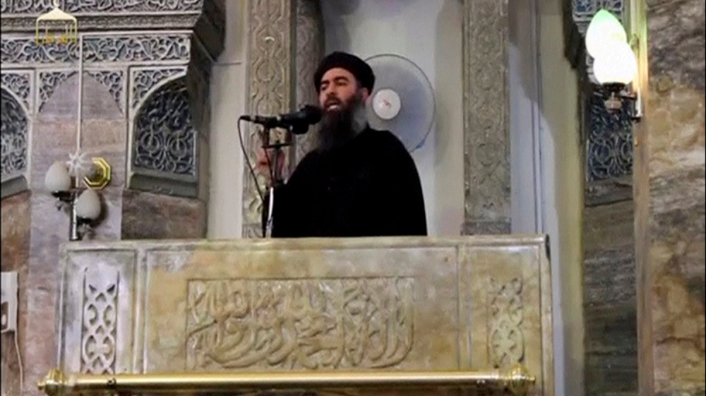 ISIL leader Abu Bakr al-Baghdadi making what would have been his first public appearance in 2014, at a mosque in the centre of Iraq's second largest city of Mosul [File: Reuters]