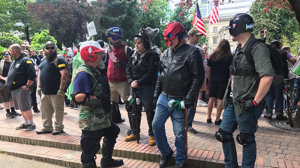Groups on the far right include Proud Boys, Oath Keepers, Three Percenters [Mike Bivins/Al Jazeera]