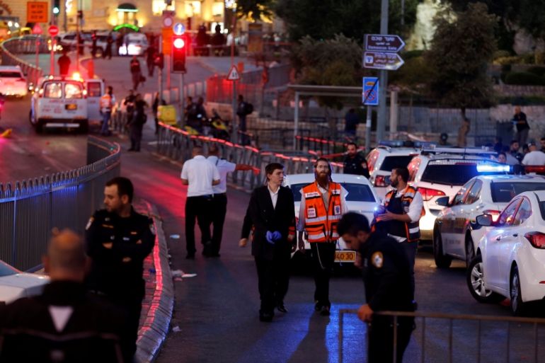 Israeli policemen secure the scene of the shooting and stabbing attack outside Damascus gate in Jerusalem''s old city