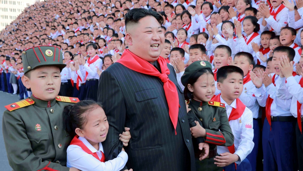 North Korean leader Kim Jong-un poses with participants during the 8th Congress of the Korean Children's Union [Reuters]