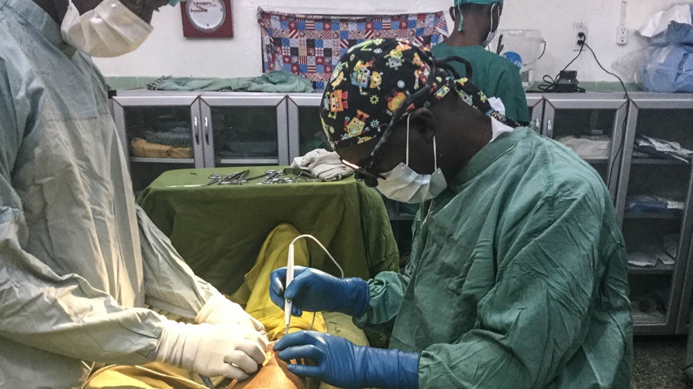 Dr Jerry Brown operating on a patient in ELWA hospital [Photo courtesy of Dr Brown]