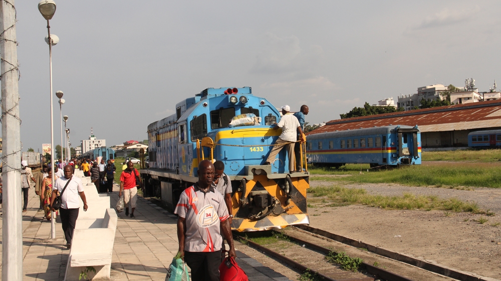 Passengers disembark at Kinshasa's rehabilitated central station, Gare de l'Est [William Clowes/Al Jazeera]