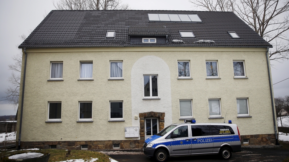 A police car is parked in front of an asylum shelter in Clausnitz in March 2016 [Hannibal Hanschke/Reuters]