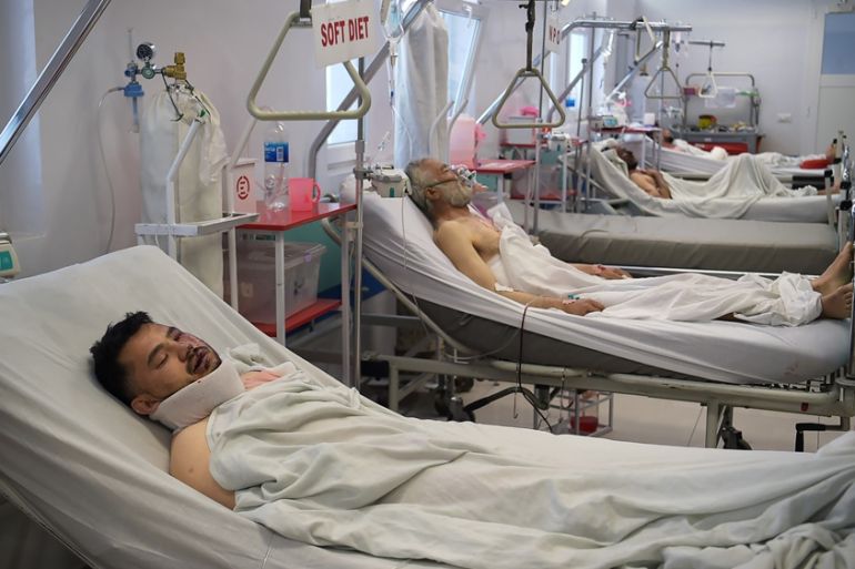 Injured Afghan men receive medical treatment