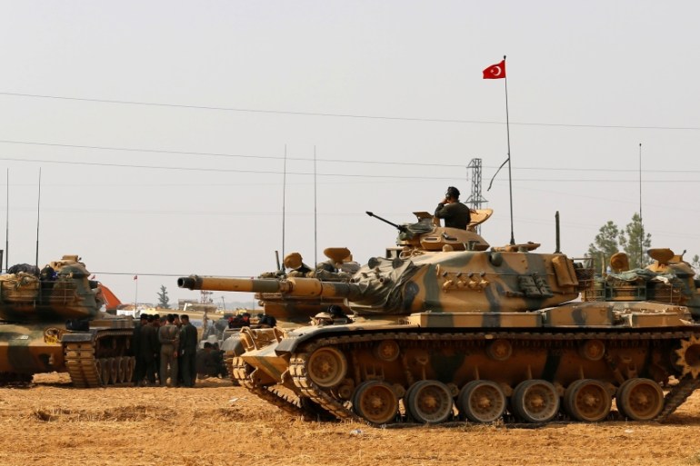 Turkish army tanks and military personal are stationed in Karkamis on the Turkish-Syrian border in the southeastern Gaziantep province