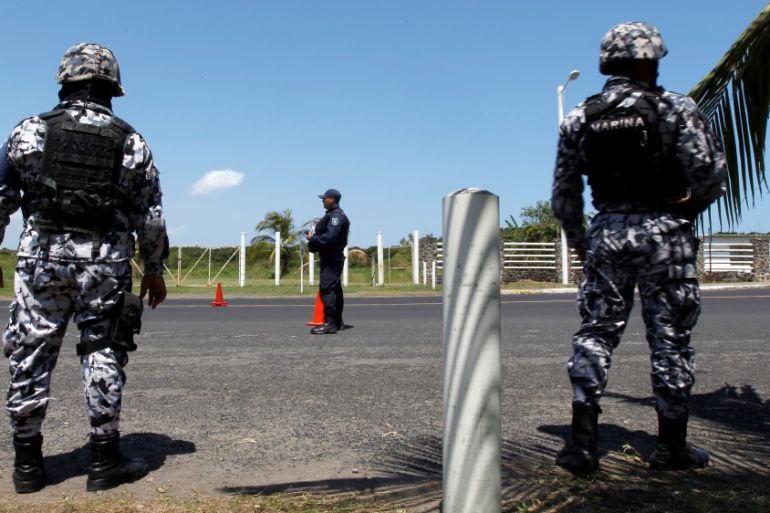 Naval police officers stand at a check point in Veracruz Port