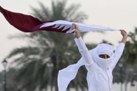 DO NOT USE - Qatari man waves flag