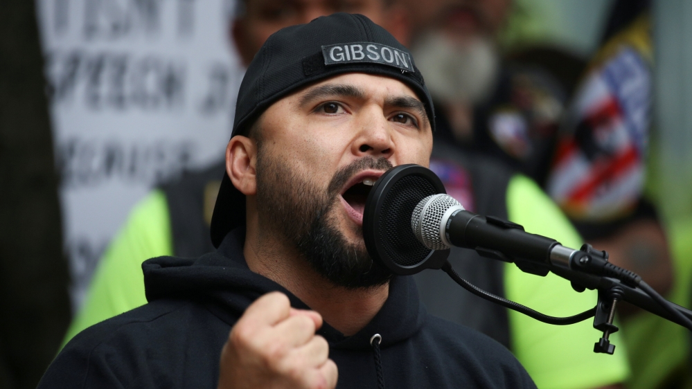 Joey Gibson speaks during a pro-Trump rally for free speech in Portland [David Ryder/Reuters]