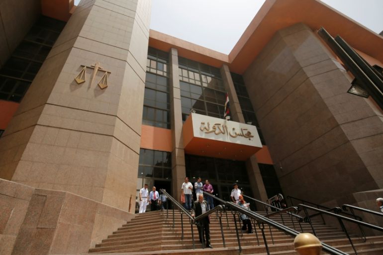 People walk at entrance of the State Council''s building, Egypt''s highest administrative court in Cairo, Egypt