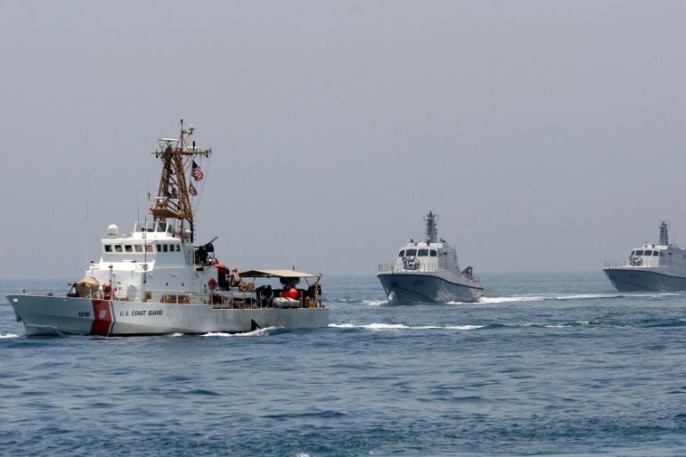Military ships are seen during a naval exercise by US and Qatari troops in the Arabian Gulf