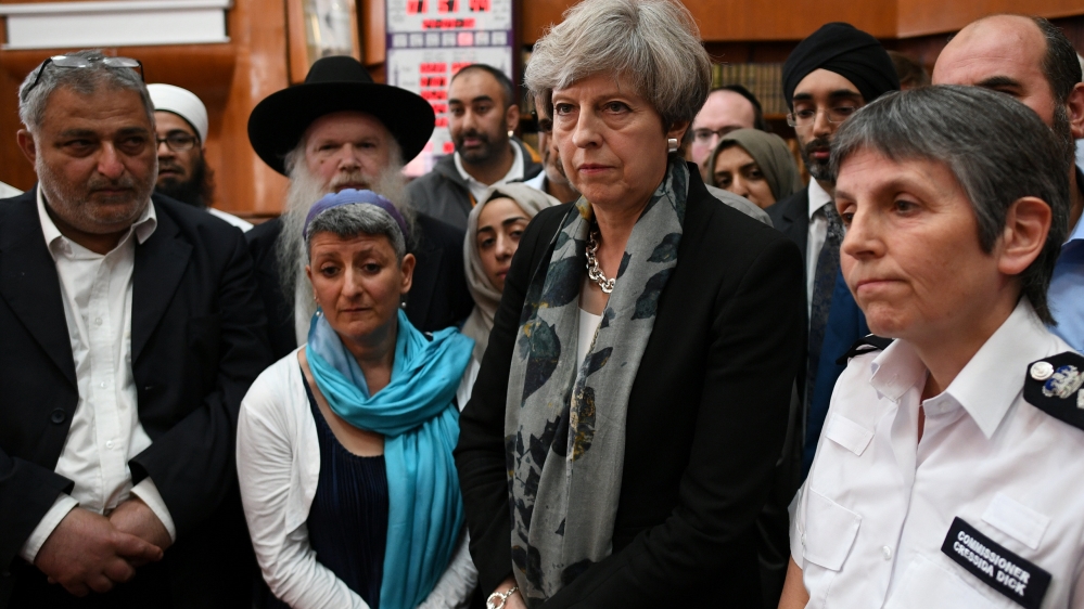 May, second right, visited the Finsbury Park Mosque on Monday [Stefan Rousseau/Reuters]