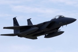 A U.S. Air Force F-15 Eagle fighter flies during a certification of the arresting gear in the military air base in Lielvarde