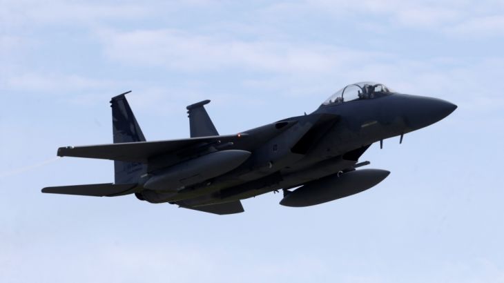 A U.S. Air Force F-15 Eagle fighter flies during a certification of the arresting gear in the military air base in Lielvarde
