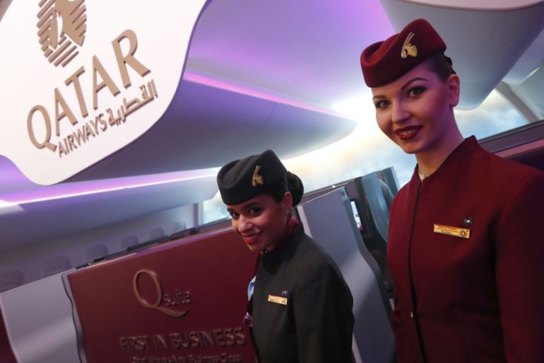 Qatar Airways stewardesses pose at the International Tourism Trade Fair ITB in Berlin