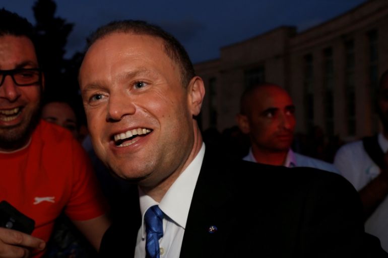 Malta''s Prime Minister and Labour Party leader Joseph Muscat poses for selfies as he arrives at a party rally in Qormi