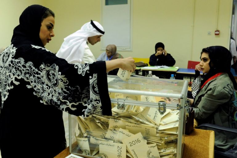 Kuwaiti woman casts her vote during parliamentary election in a polling station in Kuwait City