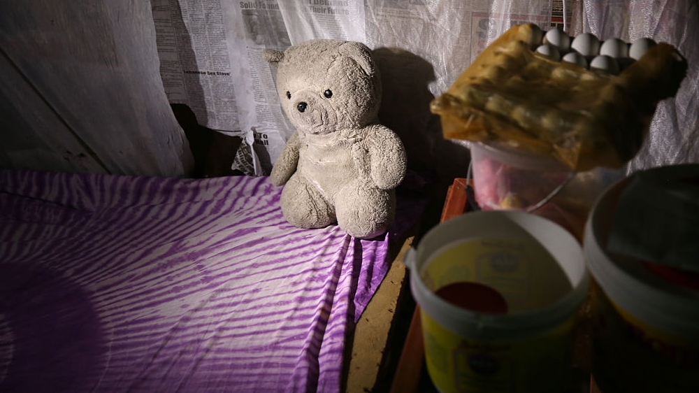  A teddy bear sits on a bed where feverish baby Benson was taken to an Ebola treatment centre in October 2014 [John Moore/Getty Images] 
