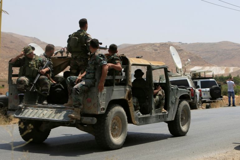 Lebanese army soldiers patrol a street in Labwe, at the entrance of the border town of Arsal, in eastern Bekaa Valley