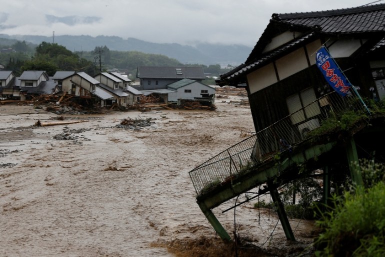 Destroyed houses are seen at an area hit by heavy rain at Haki district in Asakura, Japan
