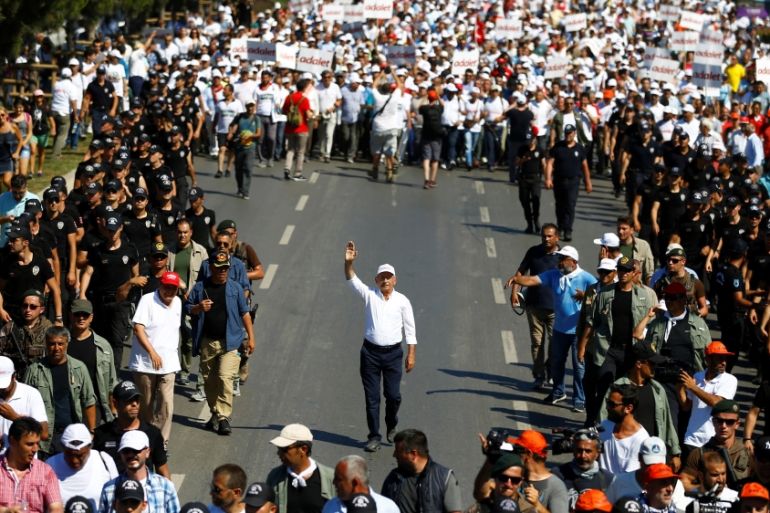 Turkey''s main opposition leader Kilicdaroglu walks flanked by his supporters during the 24th day of a protest, dubbed "justice march", in Istanbul