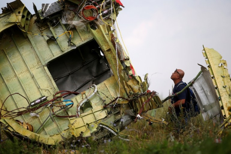 Malaysian air crash investigator inspects crash site of Malaysia Airlines Flight MH17 near Hrabove