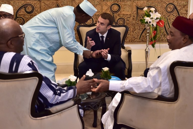 Chad''s president Idriss Deby Itno speaks with French President Emmanuel Macron during a G5 Sahel summit in Bamako