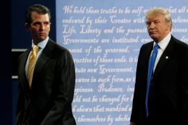 Donald Trump Jr. walks offstage with his father Donald Trump