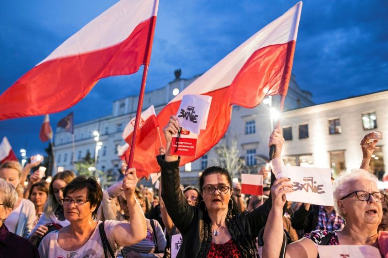 People gather during protest against Supreme Court legislation in Lublin
