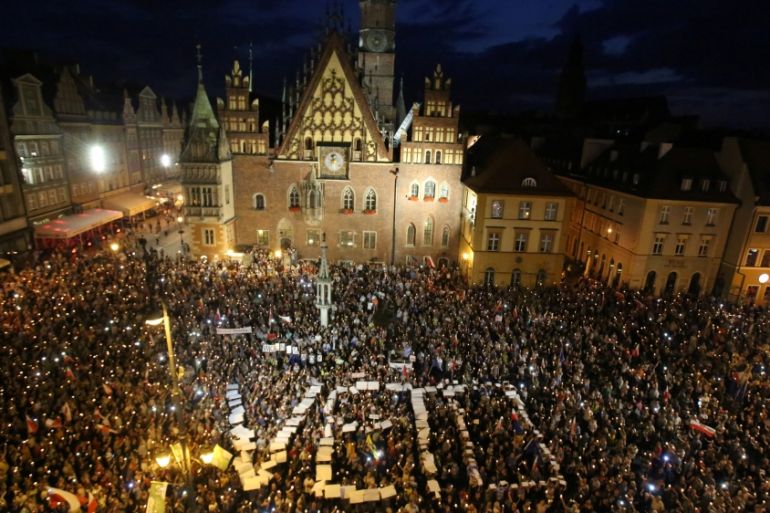 People attend a protest against supreme court legislation in Wroclaw