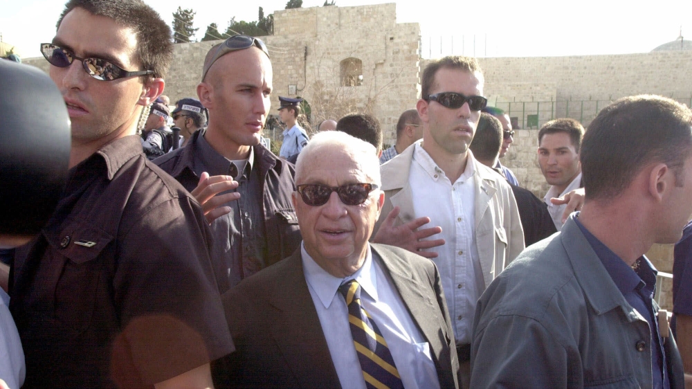 Israeli security guard Ariel Sharon at the al-Aqsa compound on September 28, 2000. Clashes erupted in Jerusalem moments after Sharon's visit to the holy site [AP Photo/Eyal Warshavsky]