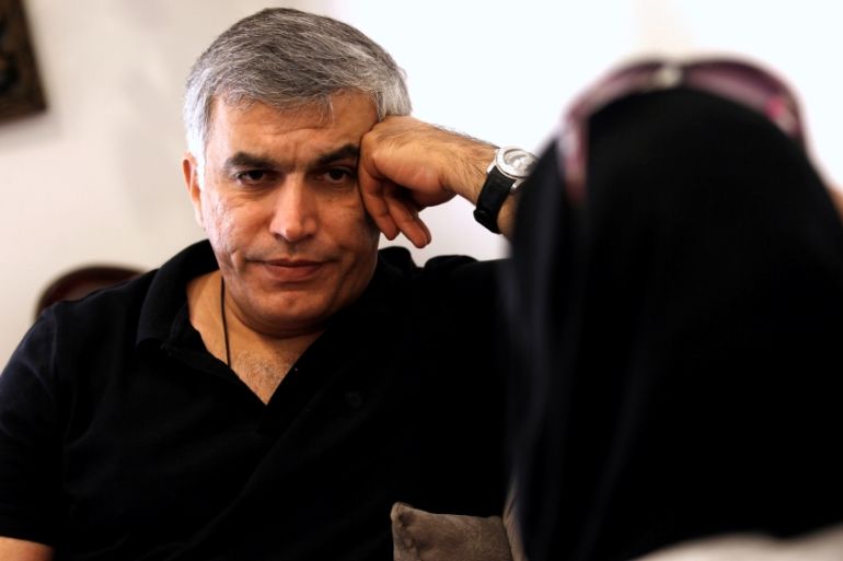 Human rights activists, Zainab al-Khawaja and Nabeel Rajab (L) talk during their meeting with activists after al-Khawaja''s release from prison, Manama, Bahrain,