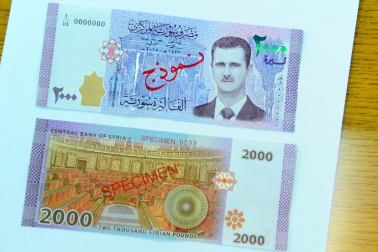 A portrait of Syria''s President Bashar al-Assad is seen printed on the new Syrian 2,000-pound banknote that went into circulation on Sunday