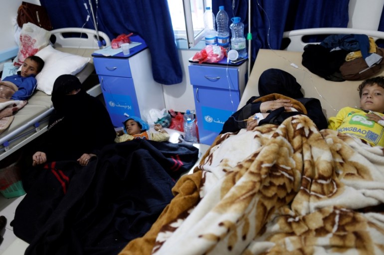 Women accompany cholera-infected children at a hospital in Sanaa
