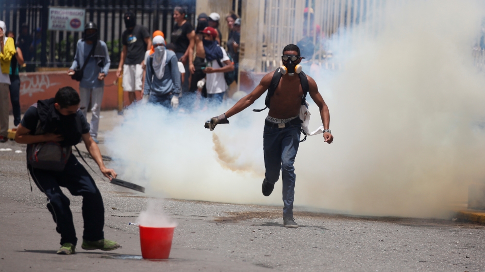 Protesters across Caracas set up roadblocks [Carlos Garcia Rawlins/Reuters]