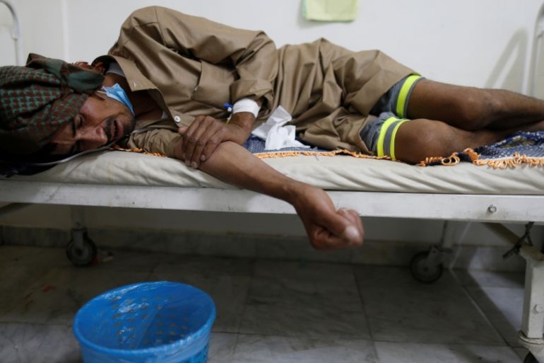 A man lies on the bed of a cholera treatment center in Sanaa, Yemen