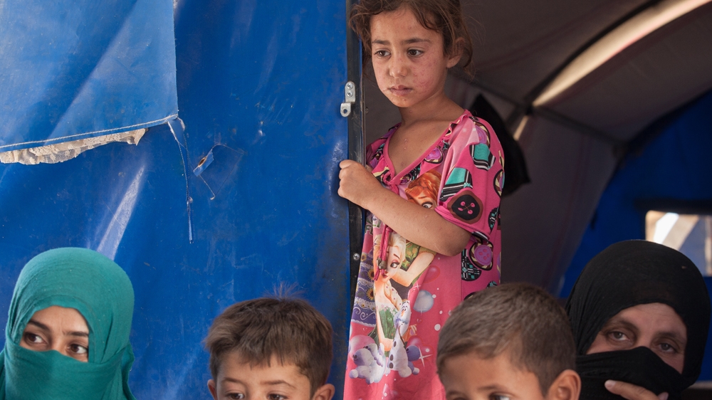 A painful rash covers the skin of Nessrine Hamad, six, who lives with her family in Shahama camp [Sebastian Castelier/Al Jazeera]