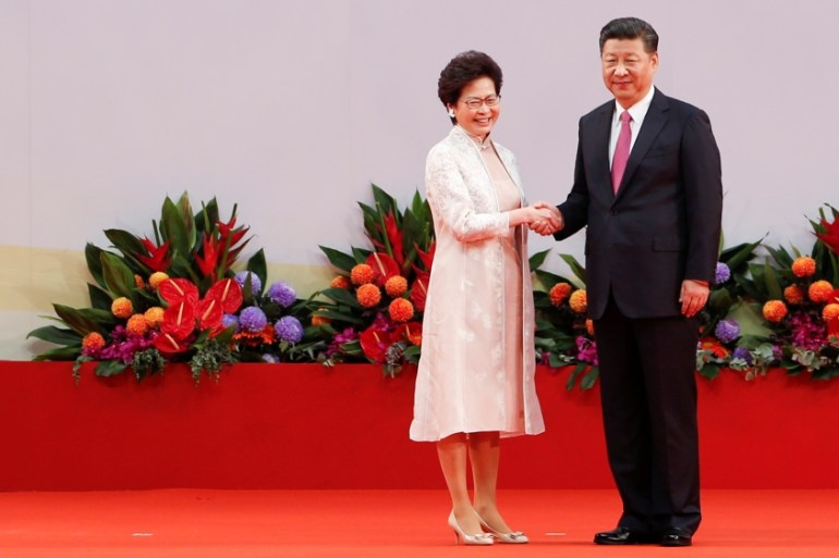Hong Kong Chief Executive Carrie Lam shakes hands with Chinese President Xi Jinping after she swore an oath of office in Hong Kong