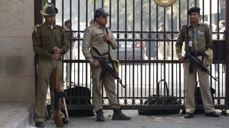 Policemen stand guard outside the high court during the bail hearing of Kanhaiya Kumar in New Delhi