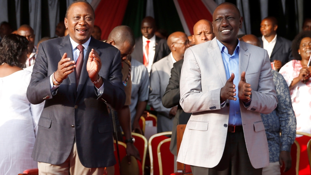 Kenya's President Uhuru Kenyatta, left, and Deputy President William Ruto attend a rally calling for peace ahead of Kenya's August 8 election in Nairobi, Kenya [Baz Ratner/Reuters]