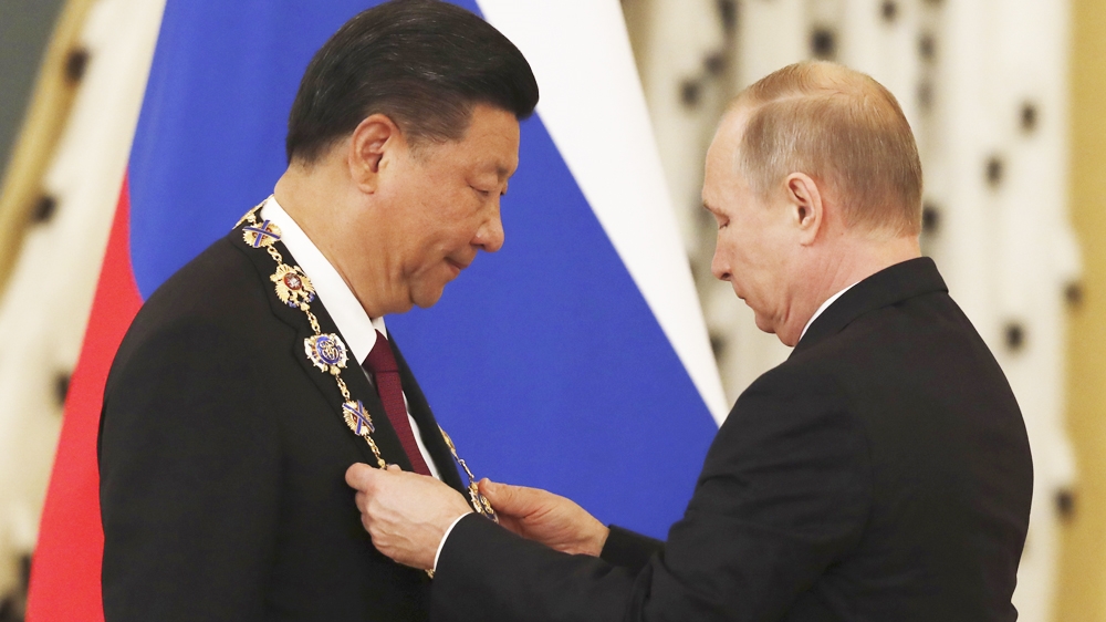 Putin hailed Xi as a 'big friend' and presented him with Russia's highest award for his efforts to strengthen ties [Reuters]