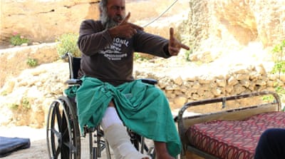 Munir al-Nuri describes how an Israeli soldier threatened to shoot him after both of his legs were broken in an April attack [Jaclynn Ashly/Al Jazeera]
