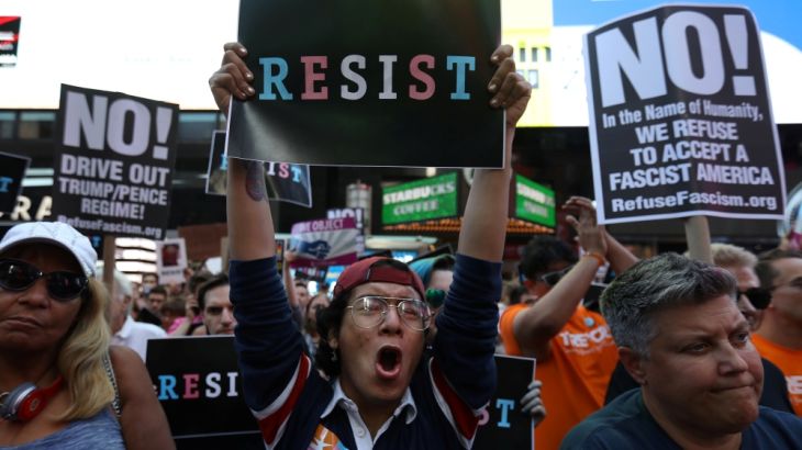 ans to reinstate a ban on transgender individualsPeople protest U.S. President Donald Trump''s announcement that he pl from serving in any capacity in the U.S. military