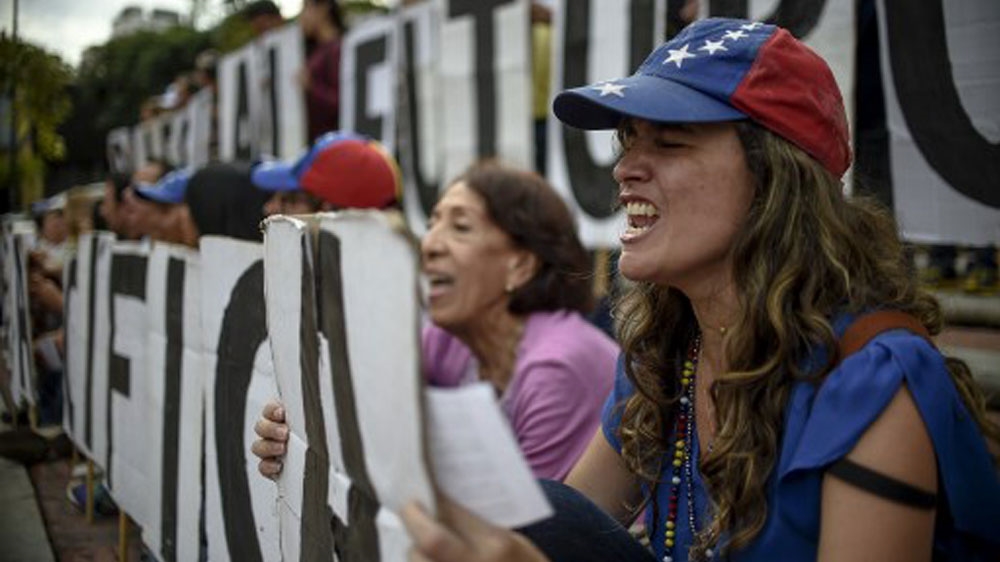 Women took part in a protest in Caracas on the eve of Sunday's vote [Juan Barreto/AFP]