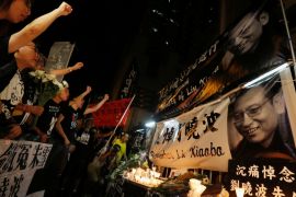 Protesters chant slogans to mourn the death of Nobel laureate Liu Xiaobo in Hong Kong
