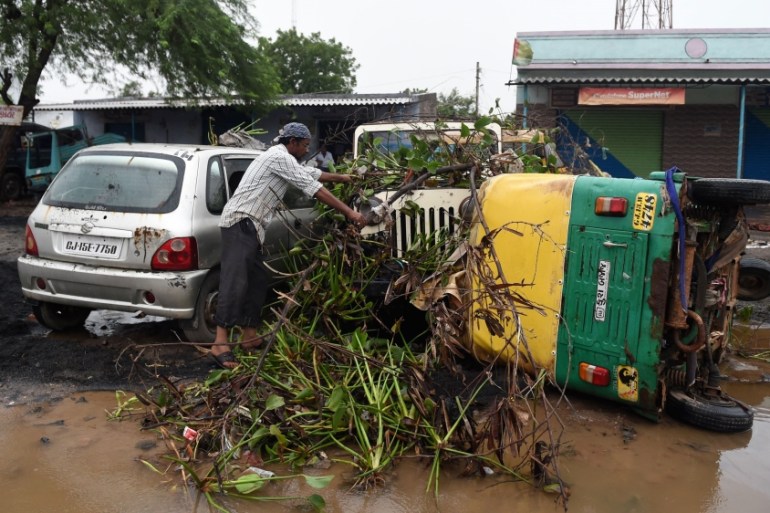 Damaged vehicles after heavy rains in Morbi districtin northern Gujarat, India. [Sam Panthaky/AFP]