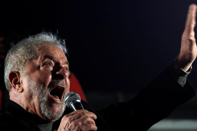 Former Brazilian President Luiz Inacio Lula da Silva gestures as he attends a protest against his conviction on corruption charges in Sao Paulo