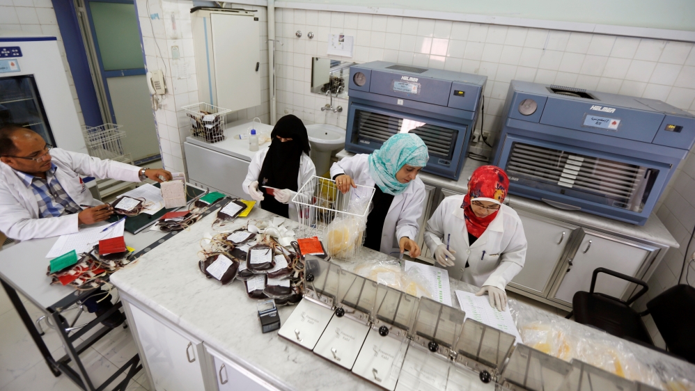 Employees register bags of blood at a blood transfusion centre in Sanaa [Khaled Abdullah/Reuters]