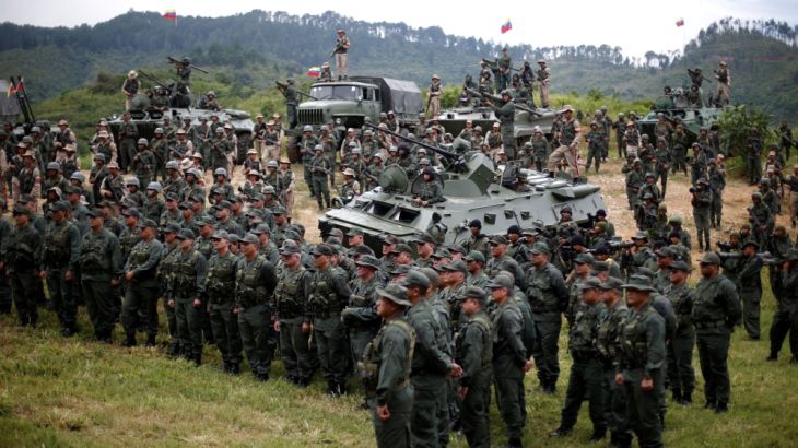 Members of the National Bolivarian Armed Forces attend a news conference of Venezuela''s Defense Minister Padrino Lopez in Caracas