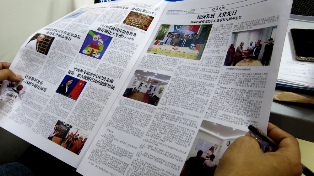 The Huashang Weekly, launched in early 2017, is Pakistan's first Chinese-language weekly and is aimed at Chinese migrants working on CPEC projects [Asad Hashim/Al Jazeera]
