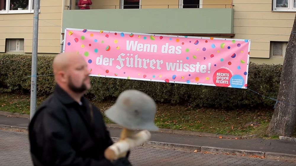 A banner reading, 'If only the Fuhrer knew!' in German is seen on the route of a neo-Nazi march in Wunsiedel in 2014 [Screenhot/YouTube via Nazis Against Nazis]